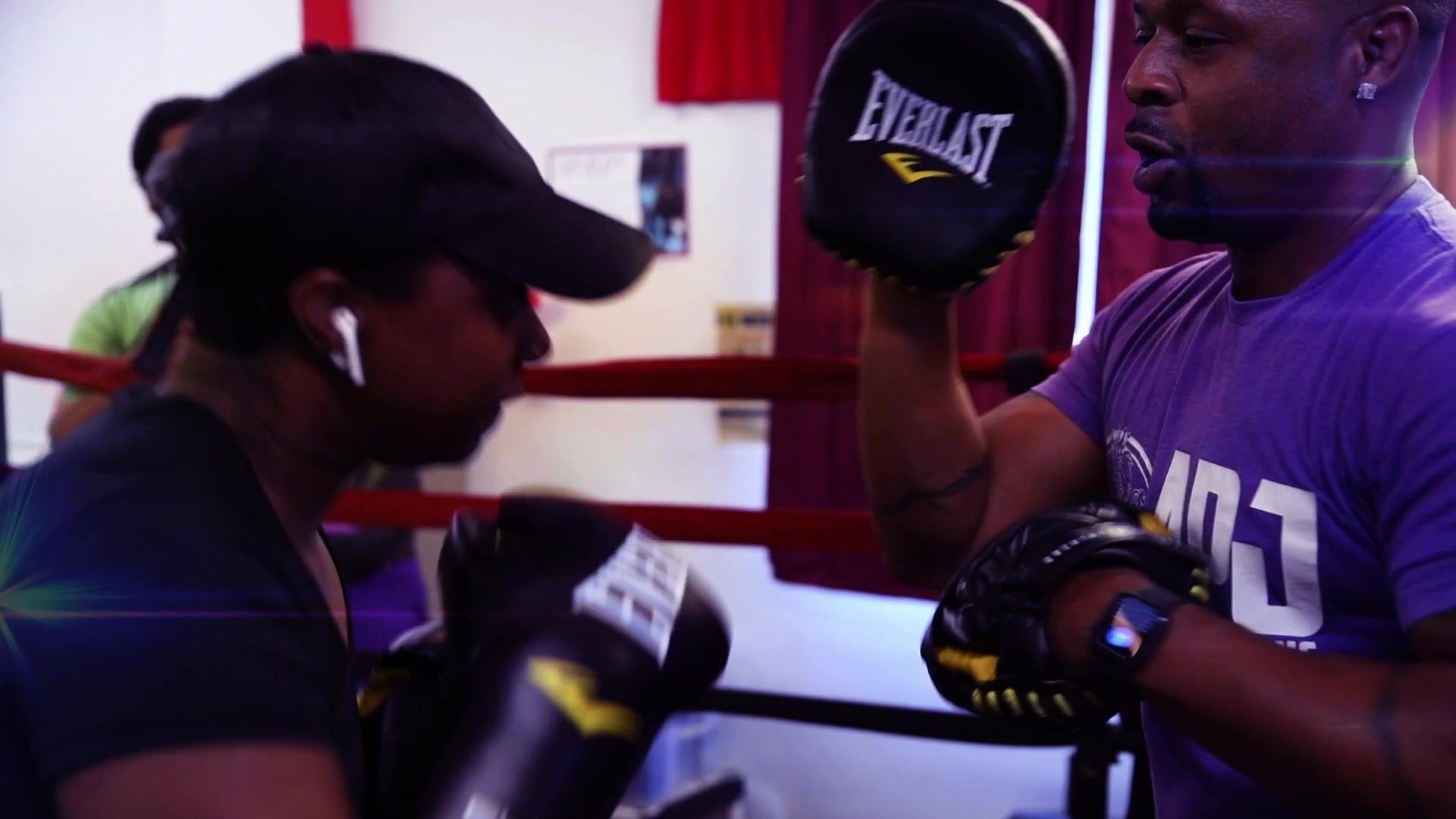 Mitt work at the ropes, the coach calling combinations while the gloves pop into his pads.