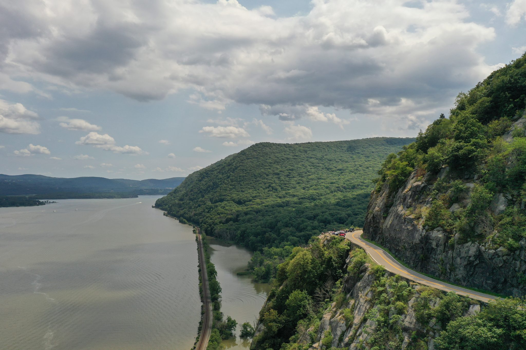 From above, the road clings to the cliffs as the Hudson winds between the mountains.