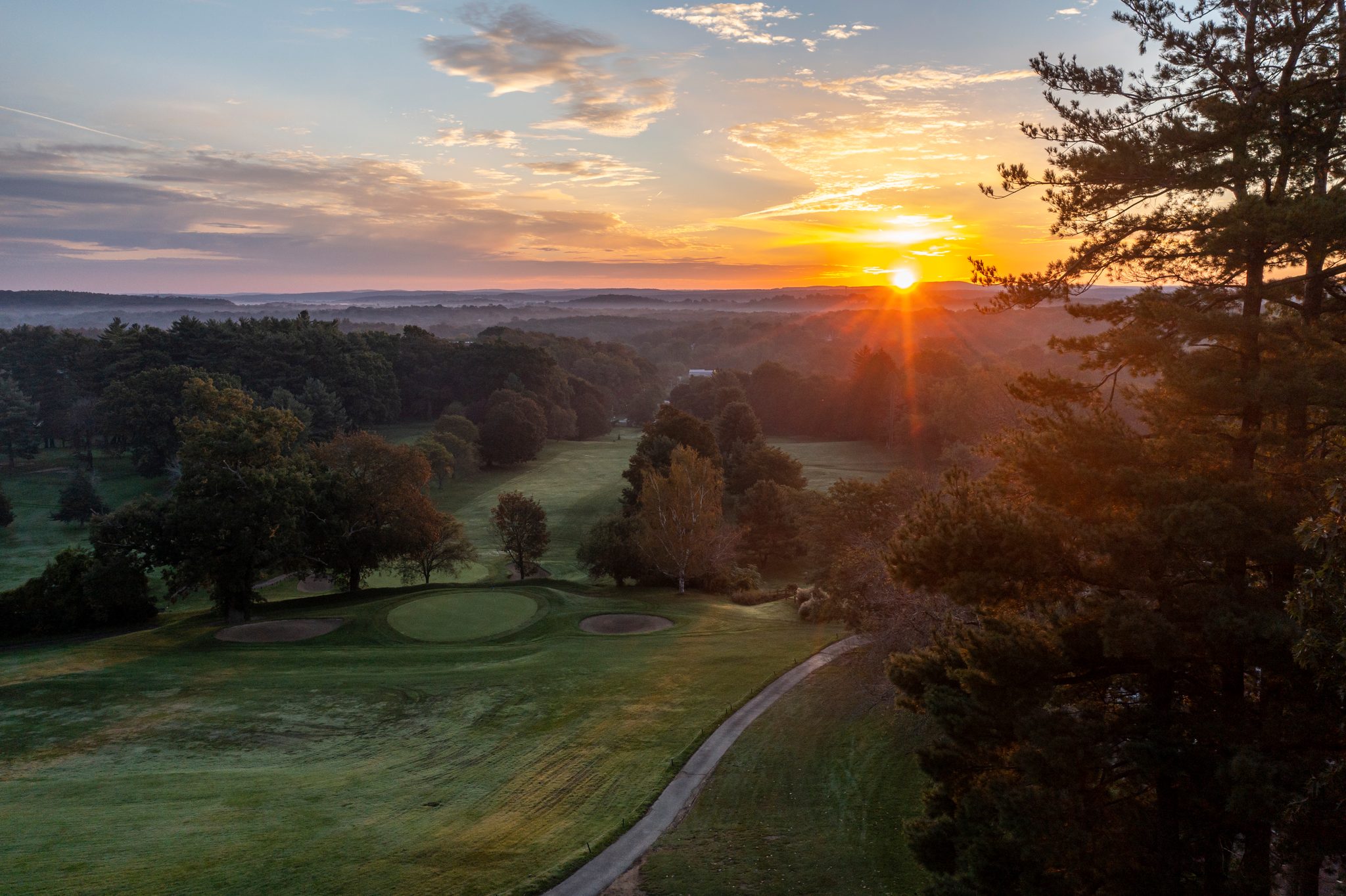 Sunrise over the course before the first tee time.