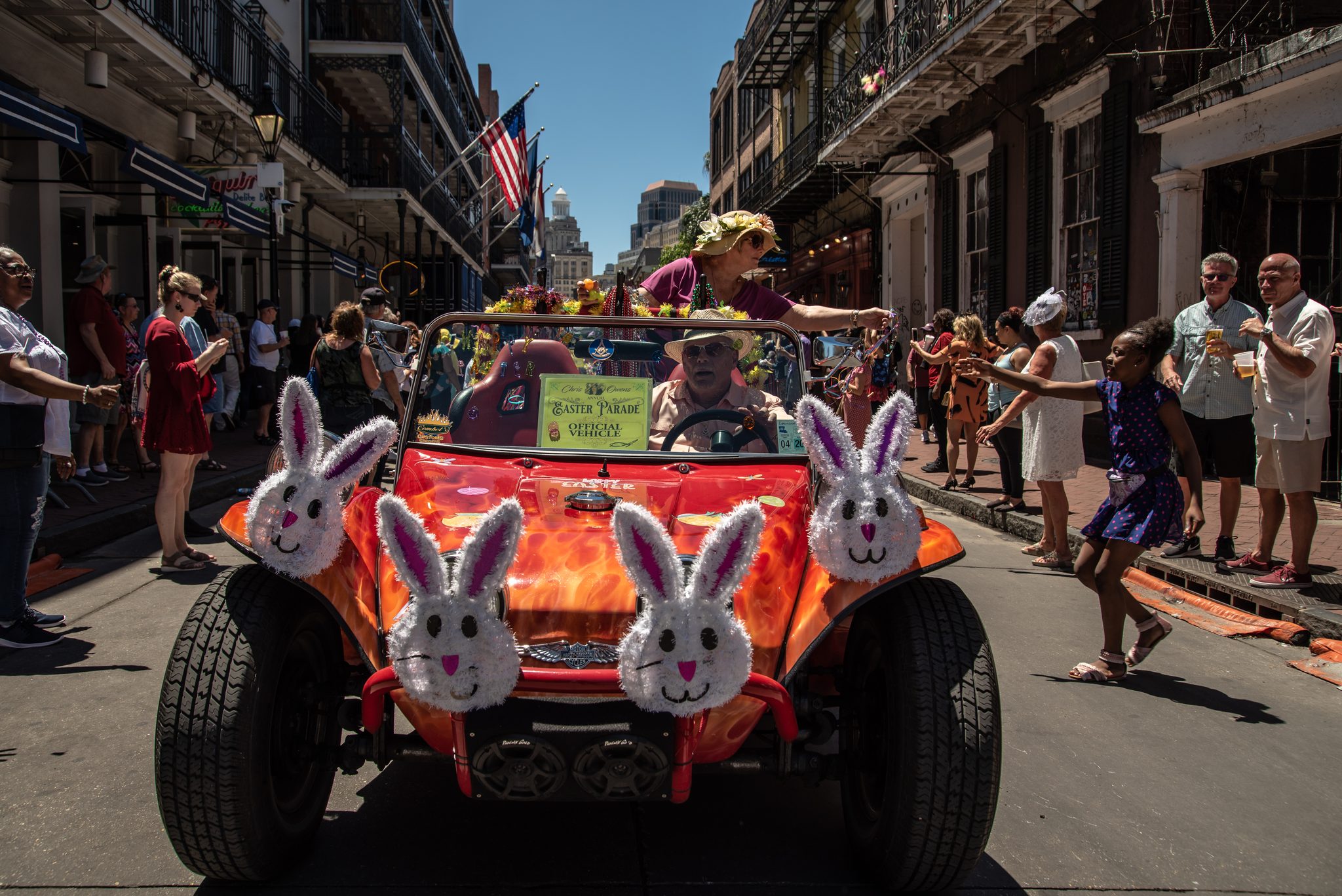 Four plush bunnies ride the grille of a flame-painted dune buggy.
