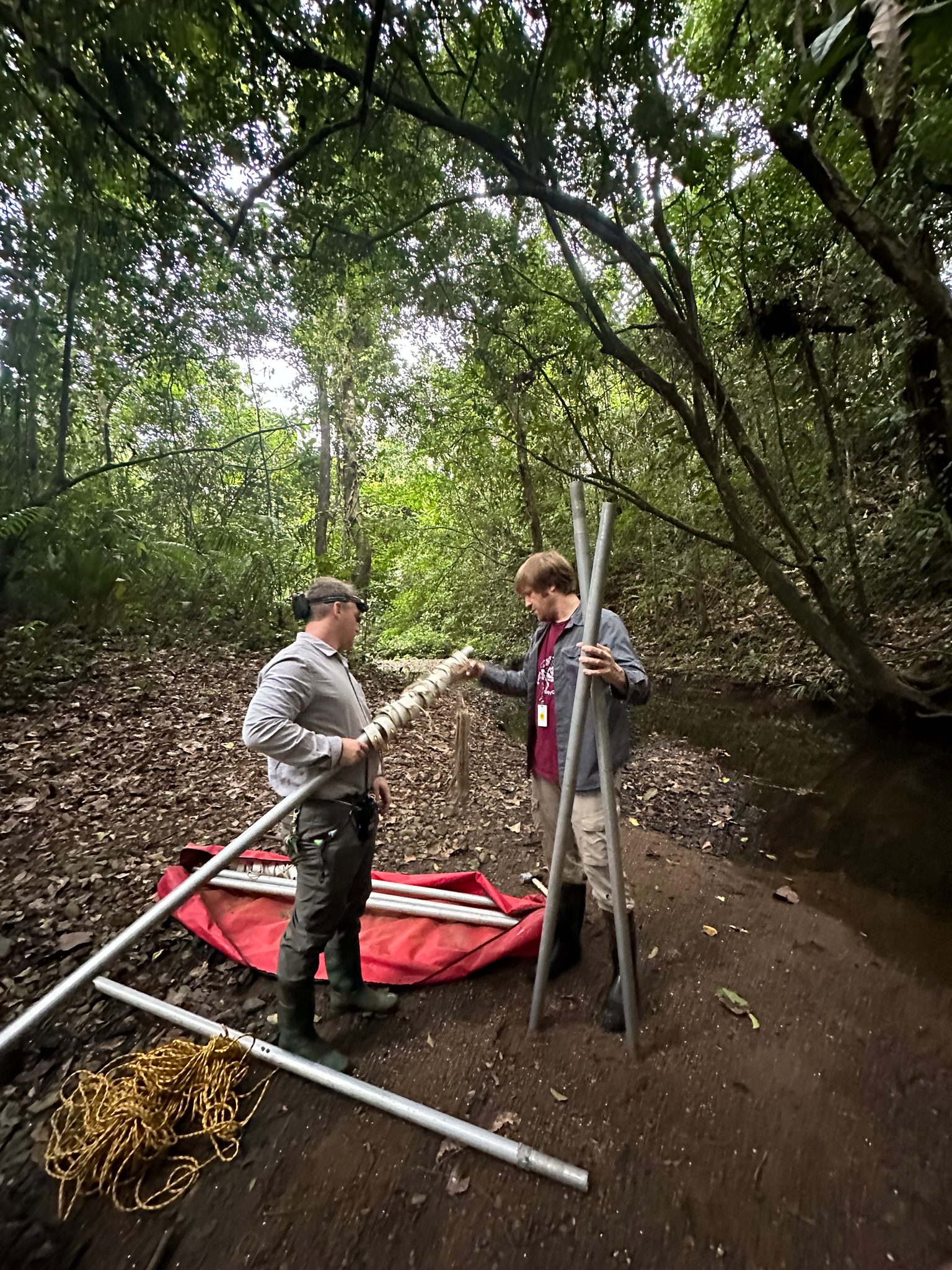 Setting the net poles in the stream before dark.