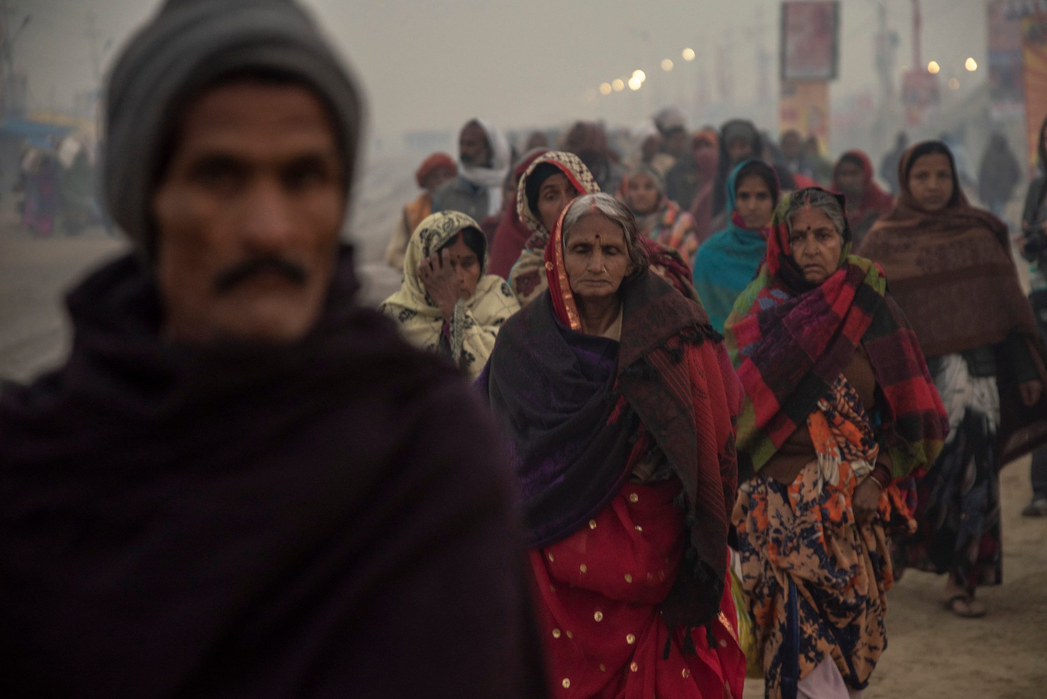 Group of women led through the Mela.
