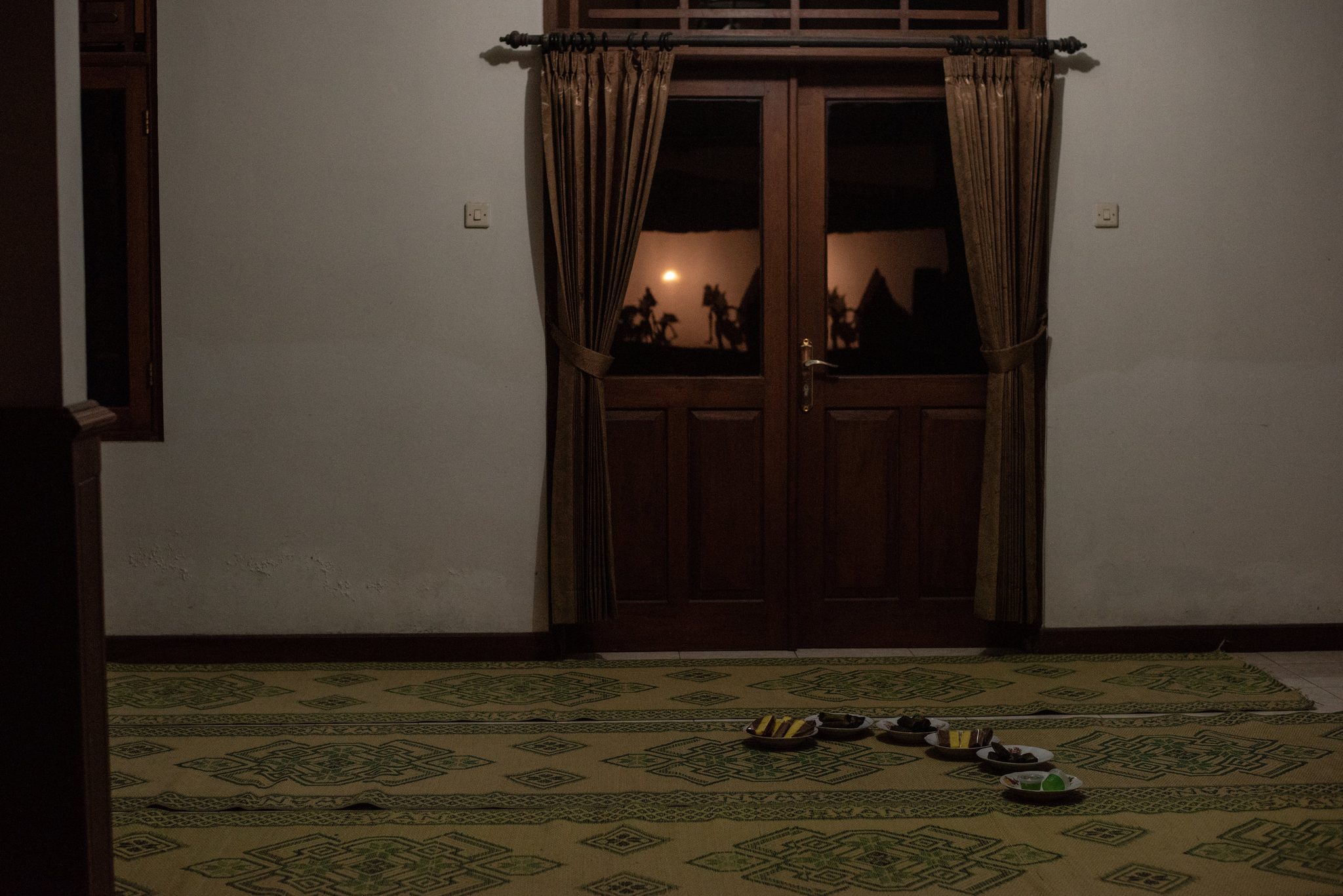 Sweets for children are placed in front of a door during the performance