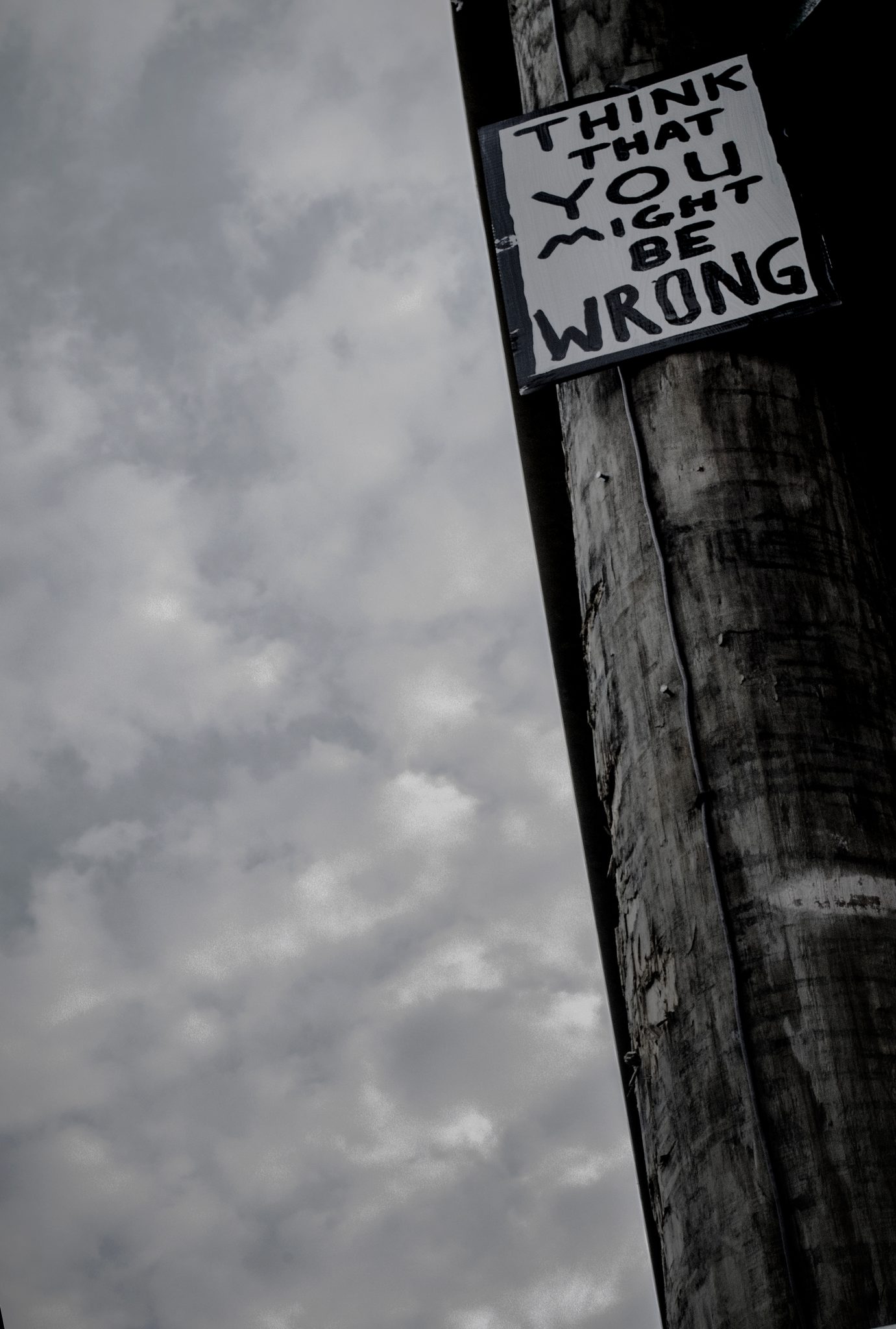 Think that you might be wrong, says the sign on the telephone pole.
