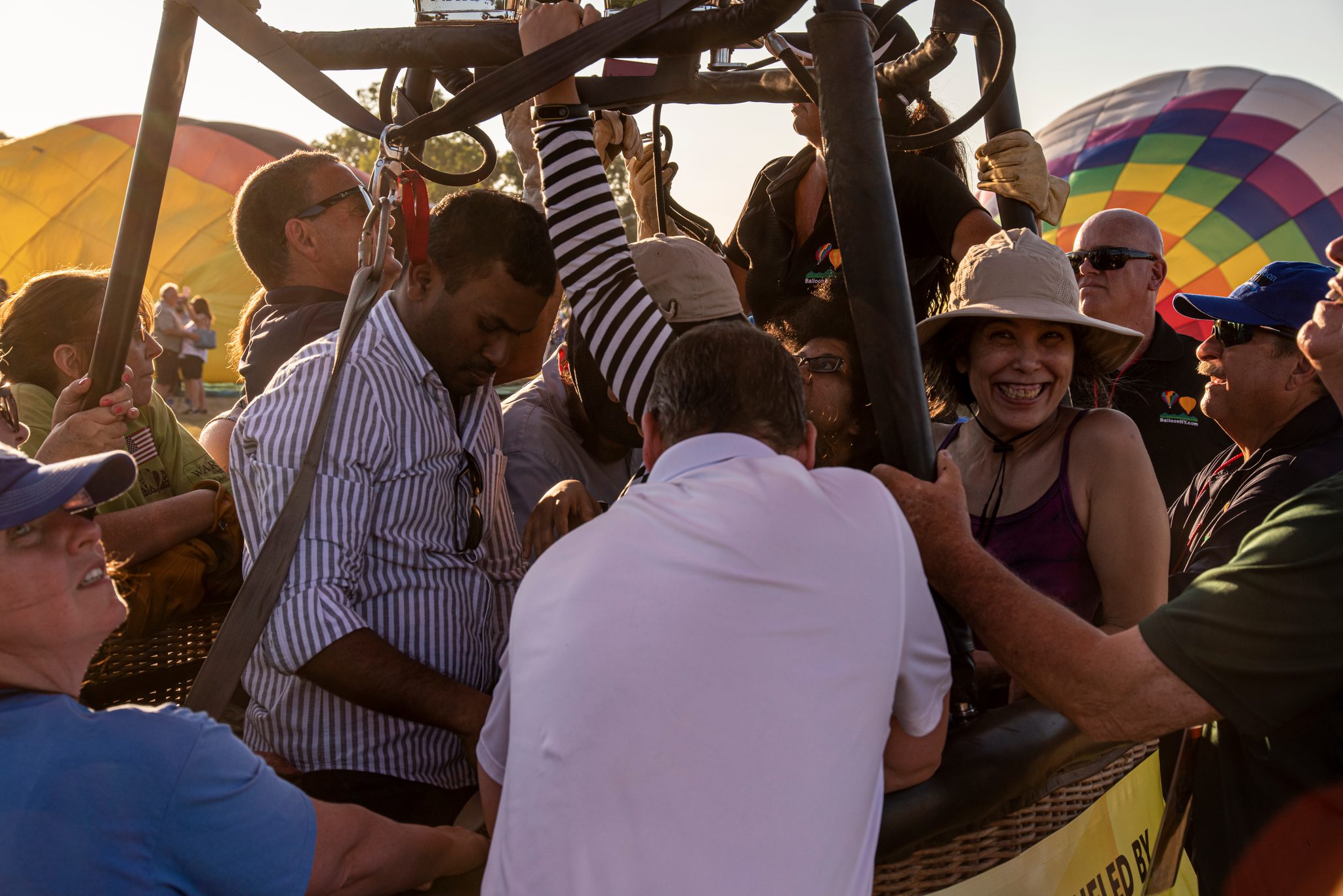Passengers pack into the basket, and one woman can't stop grinning.