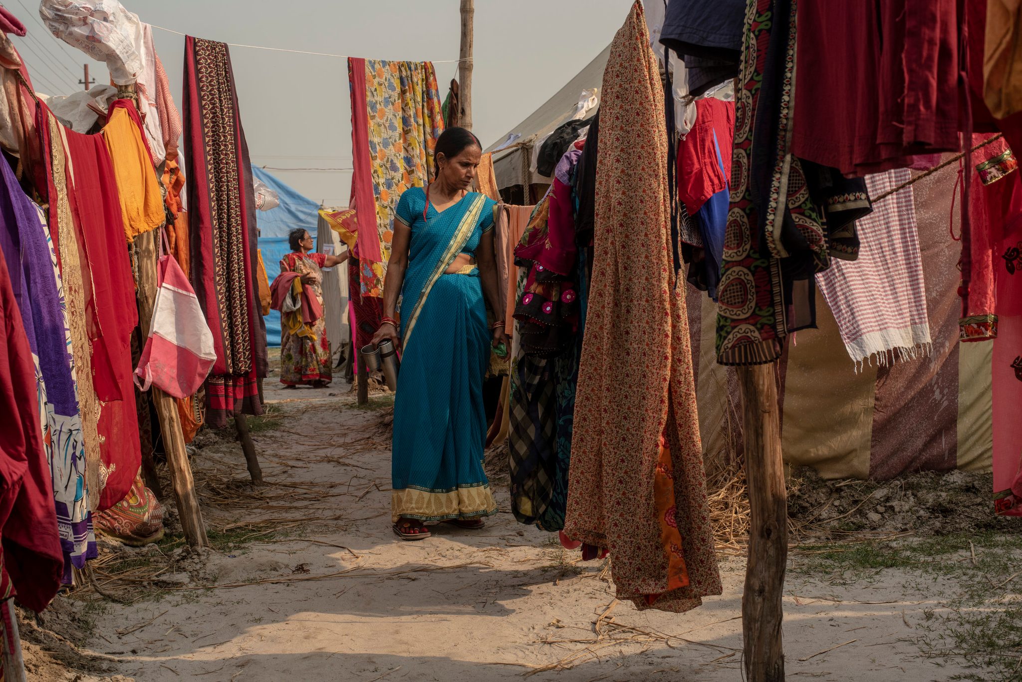 Women hang sarees out to dry