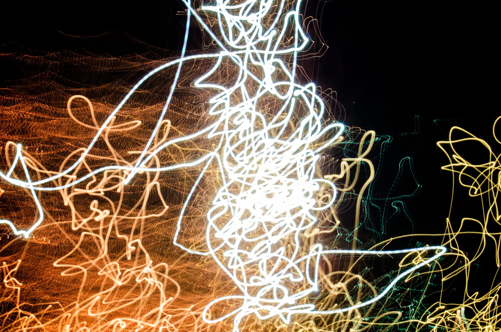 Streaks of light scribble across the dark.