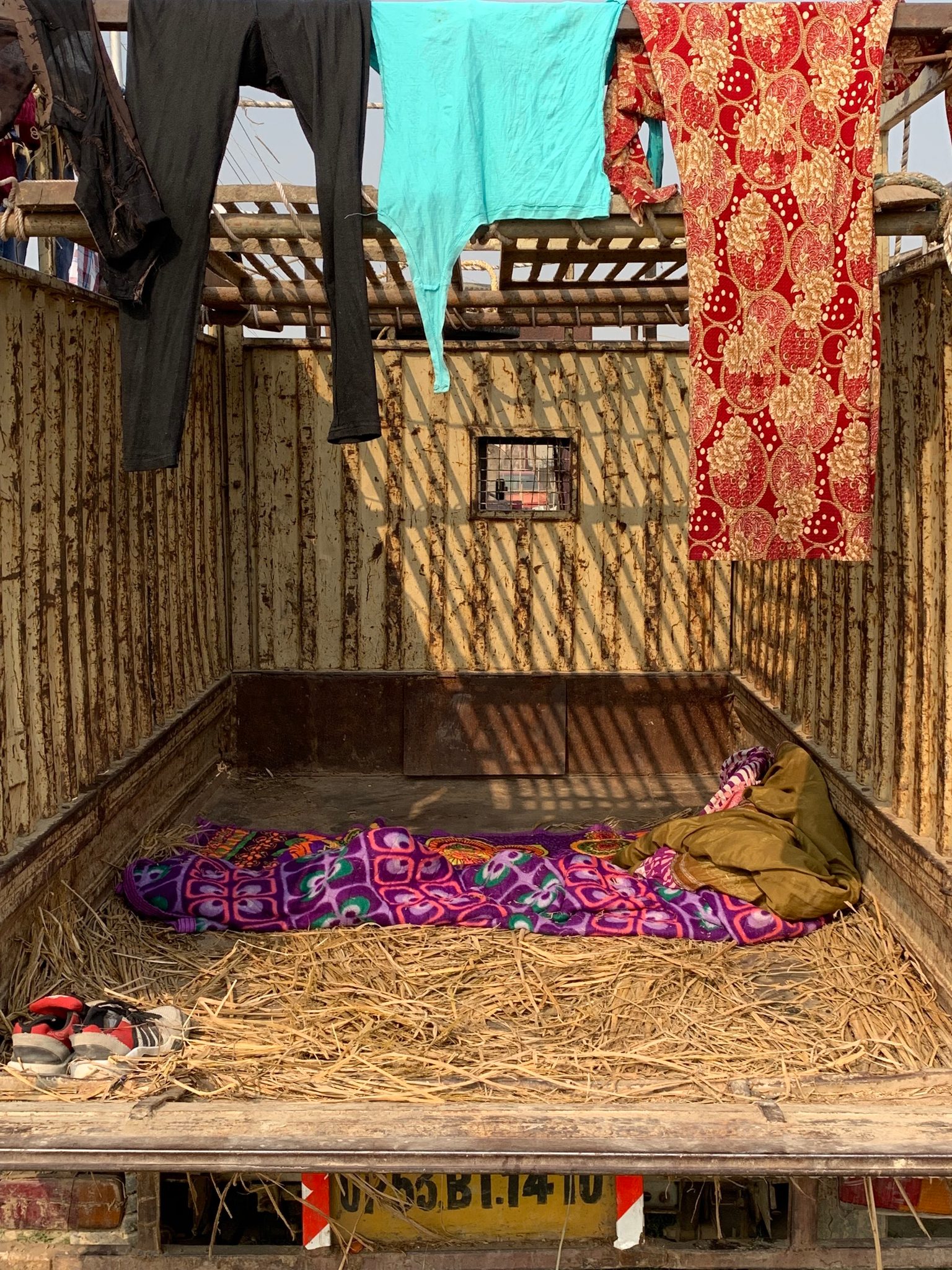 The back of a truck doubles as a bed and laundry room.