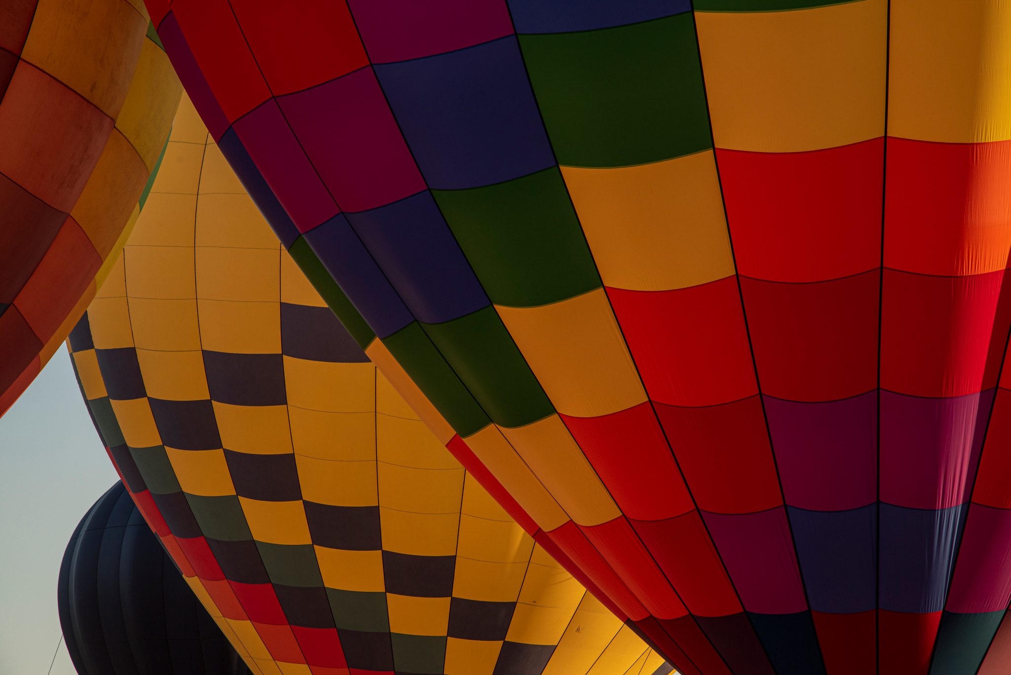 Seen up close, the balloons become a quilt of red, gold and green.