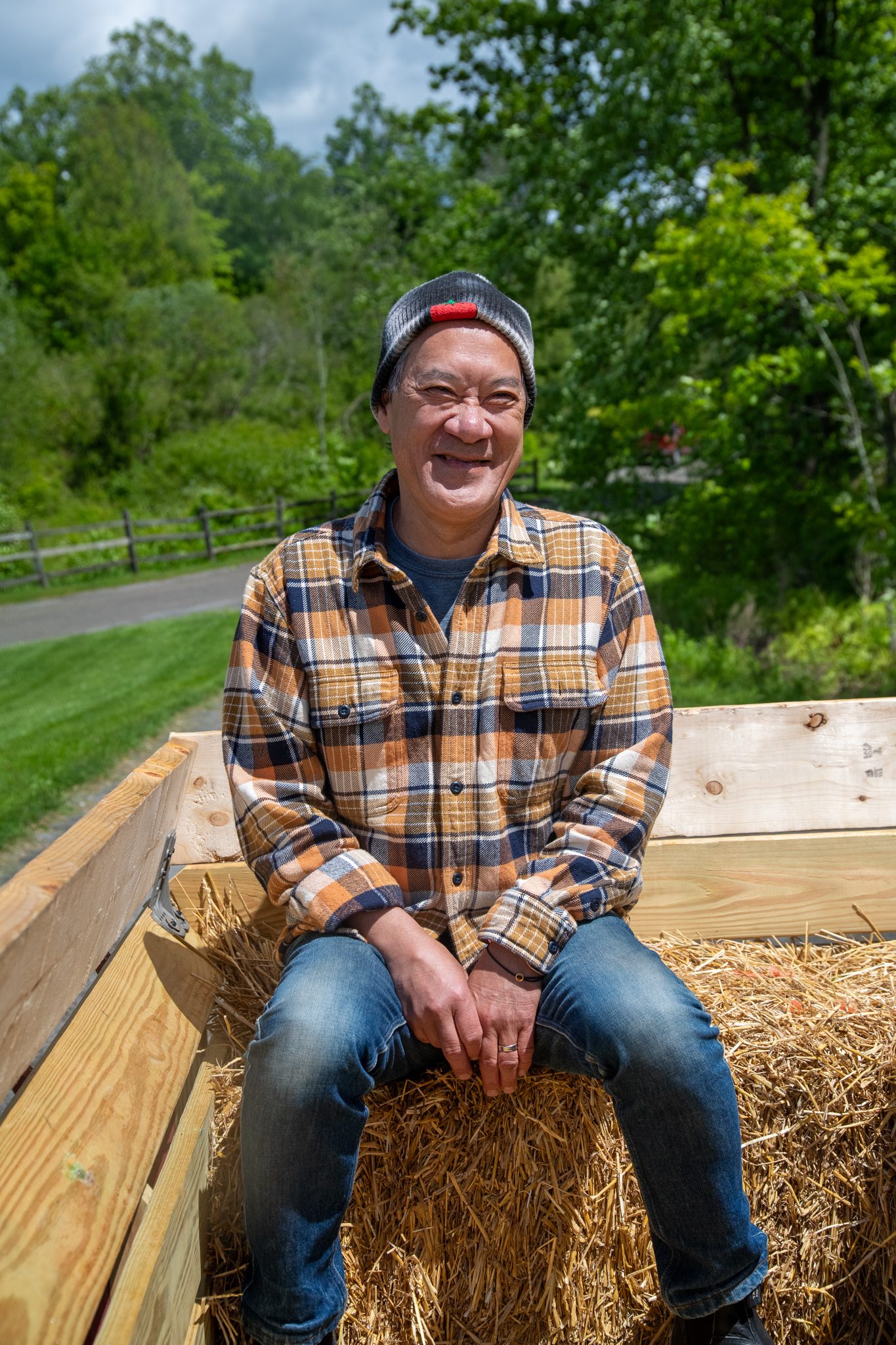 All smiles on a hay bale at the back of the wagon.