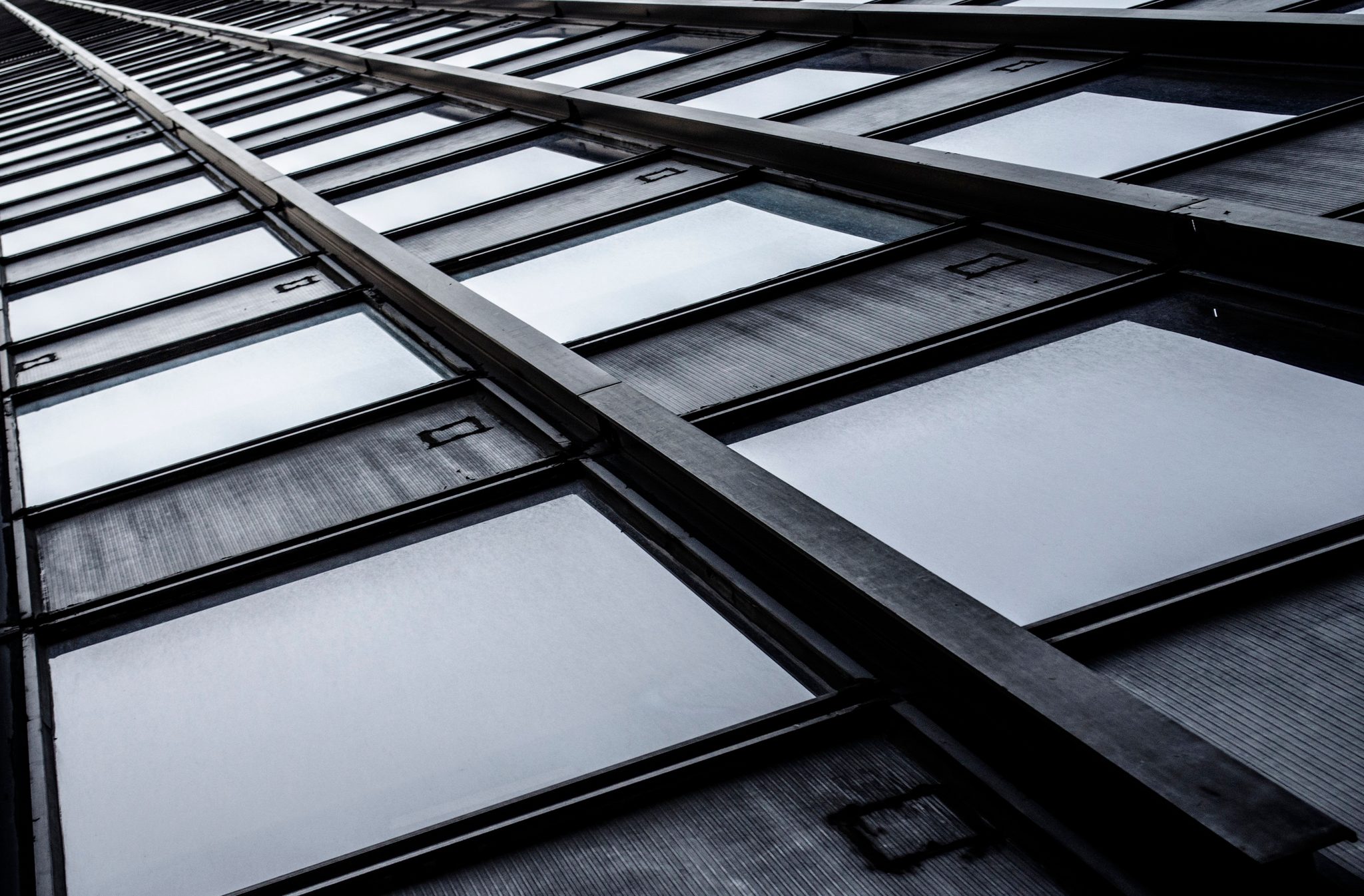 Steel beams and glass panes race toward a single point downtown.